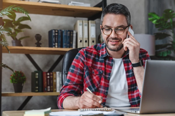 Business owner reviewing 401(k) plan documents as trustee